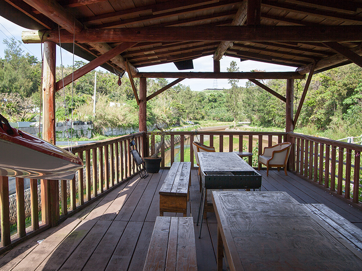 A river flows by underneath the terrace.